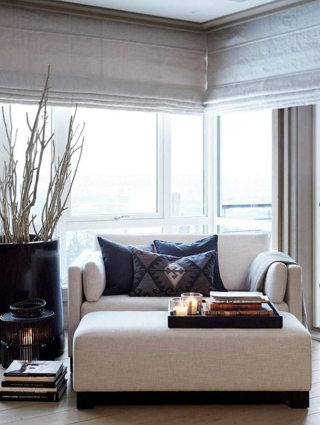 Cream Chair With Dark Patterned Pillows