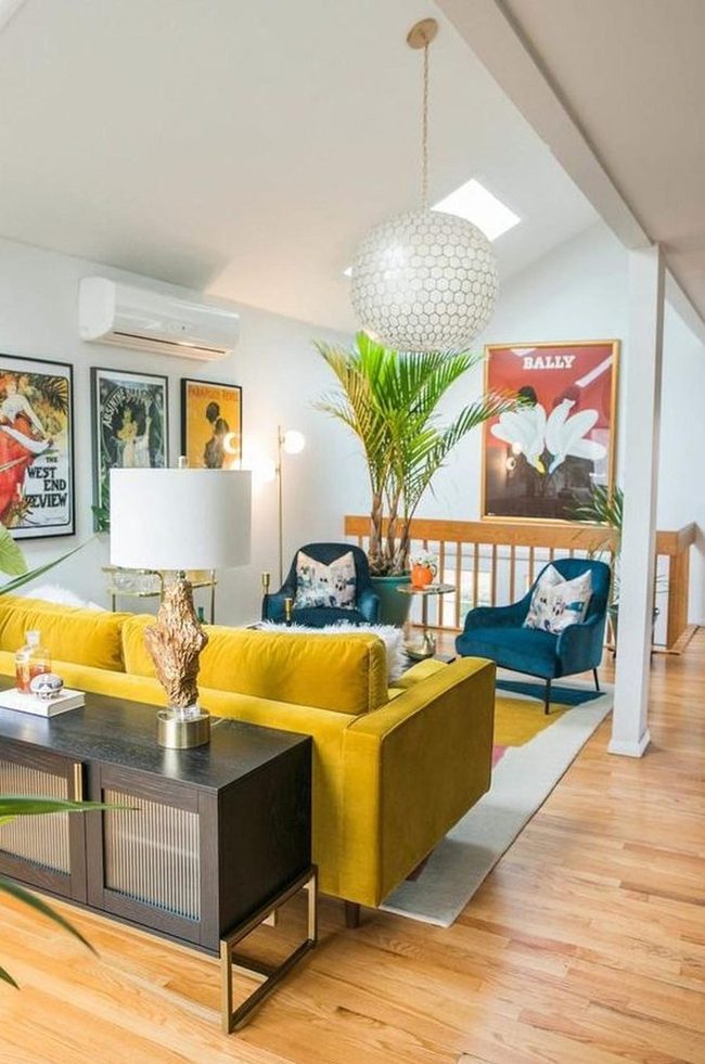 Sunny Yellow Sofa With Vibrant Blue Chairs