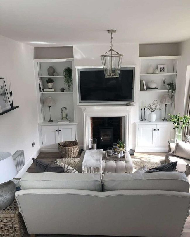 Light Gray Sofa Faces Brick Fireplace