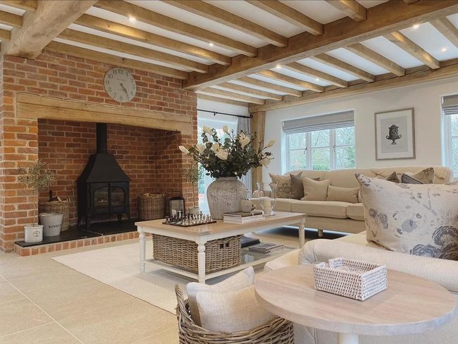 Exposed Beams And Brick Fireplace