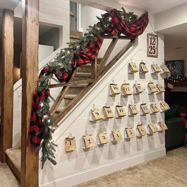 Tan Wood Staircase With Pine Garland