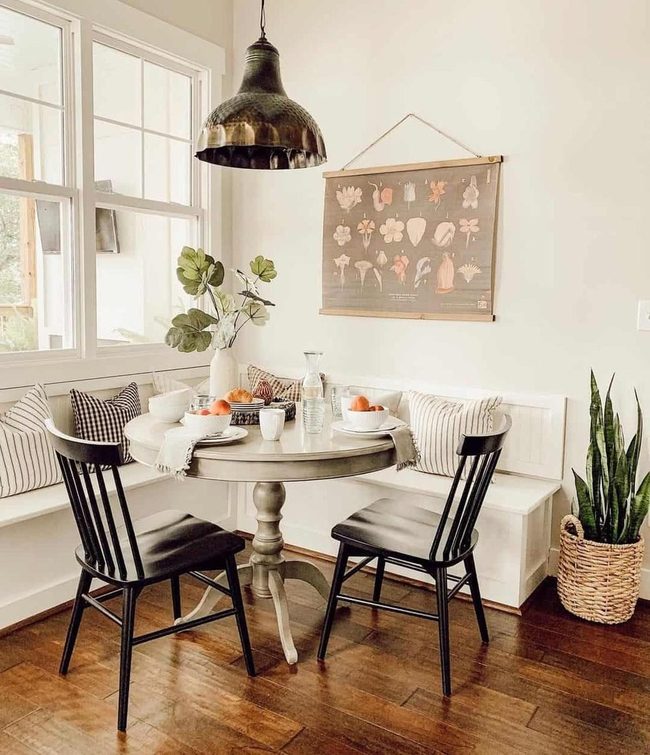White Banquette Meets Gray Round Table