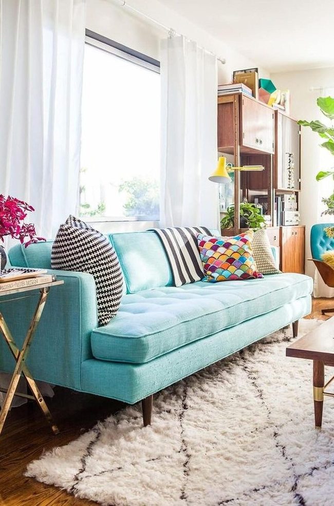 Turquoise Sofa With Patterned Pillows