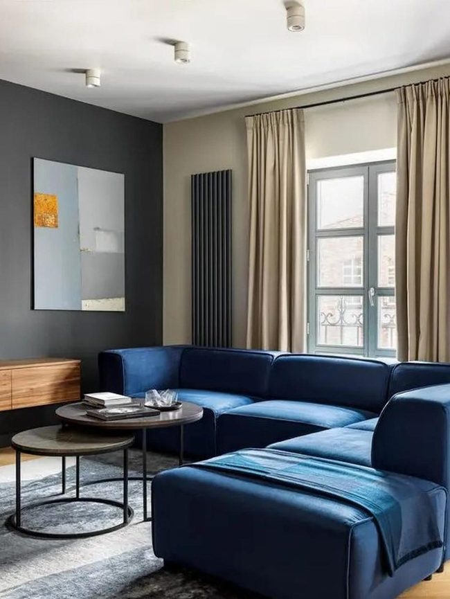 Deep Blue Sofa Meets Soft Gray Light