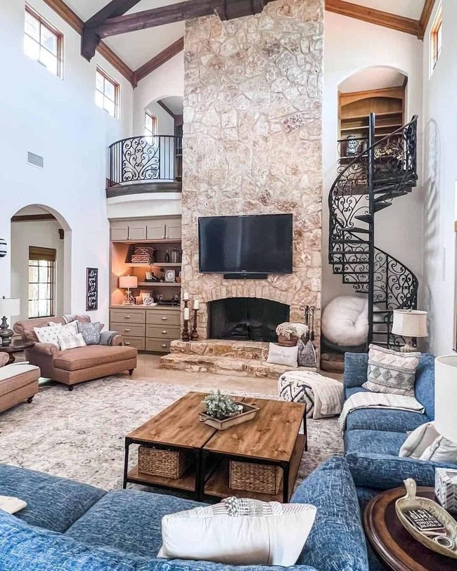 Black Spiral Staircase Meets Vaulted Wood
