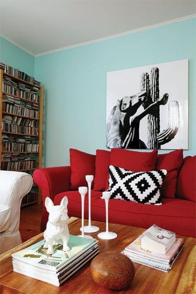 Red Sofa Against Soft Blue Walls