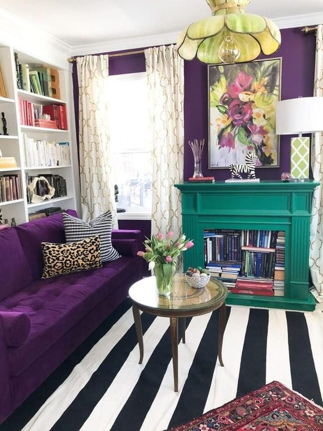 Purple Walls With Emerald Fireplace Bookshelf