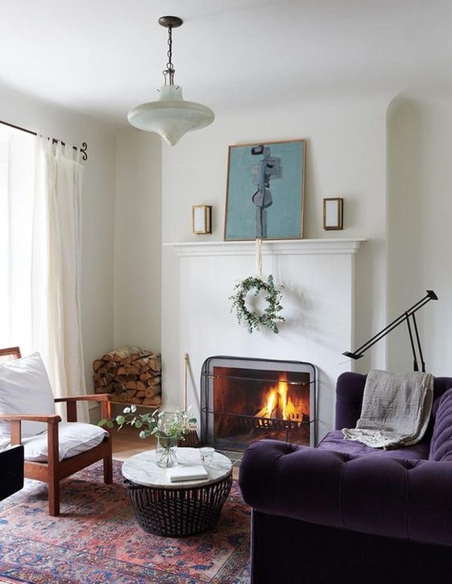 Purple Sofa Meets Glowing Fireplace