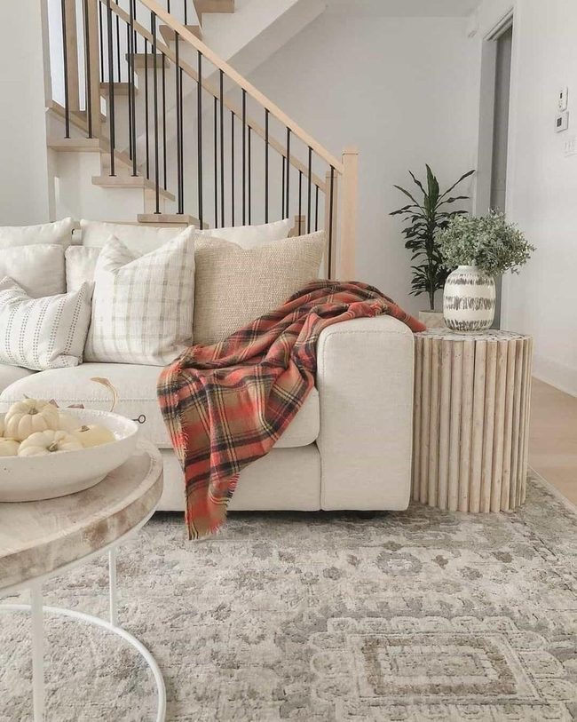 Cream Couch With Eucalyptus Accents