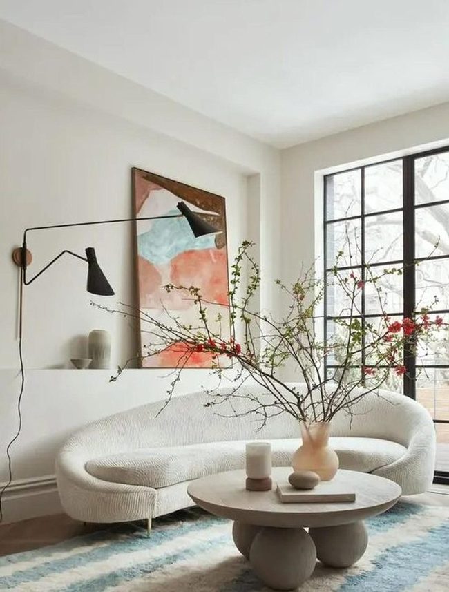 Red Branches, Blue Rug, White Sofa