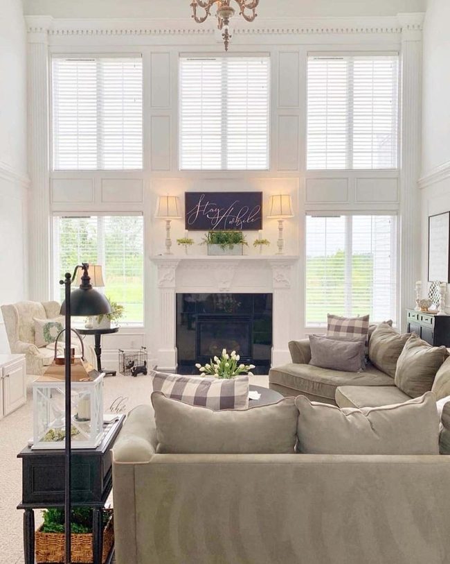 Gleaming White Sconces Brighten Open Living Room