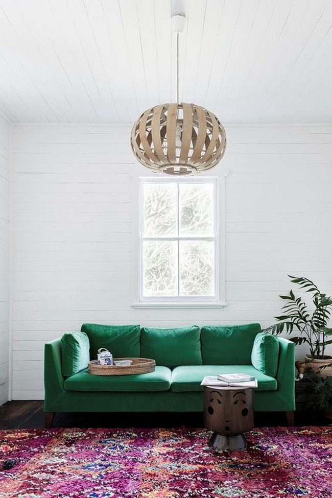 Green Couch, White Walls, Dark Floors