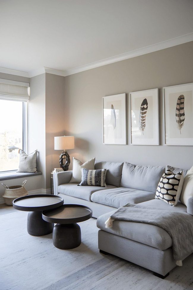 Grey Sectional With Patterned Cushions And Feather Art