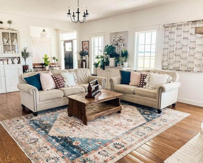 Black Chandelier Anchors Vintage Living Room