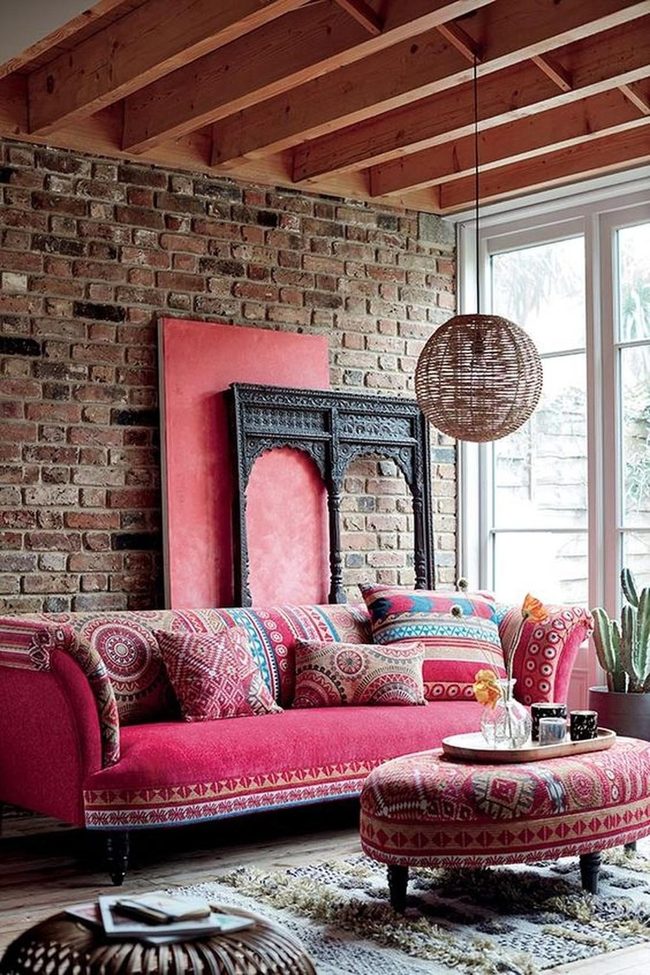 Red Sofas Against Exposed Brick