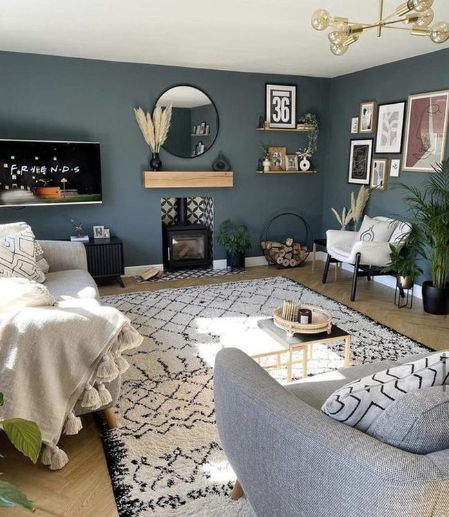 Dark Blue Walls Meet Round Mirror Fireplace