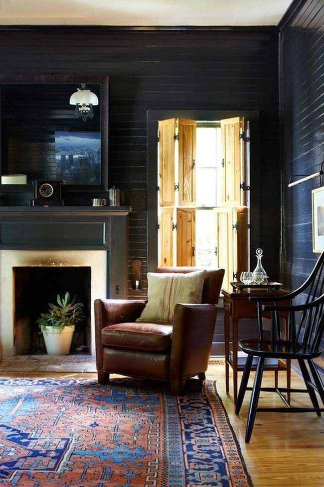 Dark Wood Fireplace With Green Plant