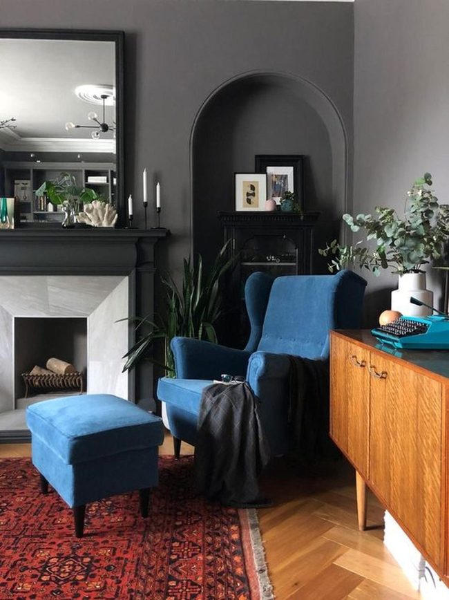 Deep Blue Chair With Red Rug Accent