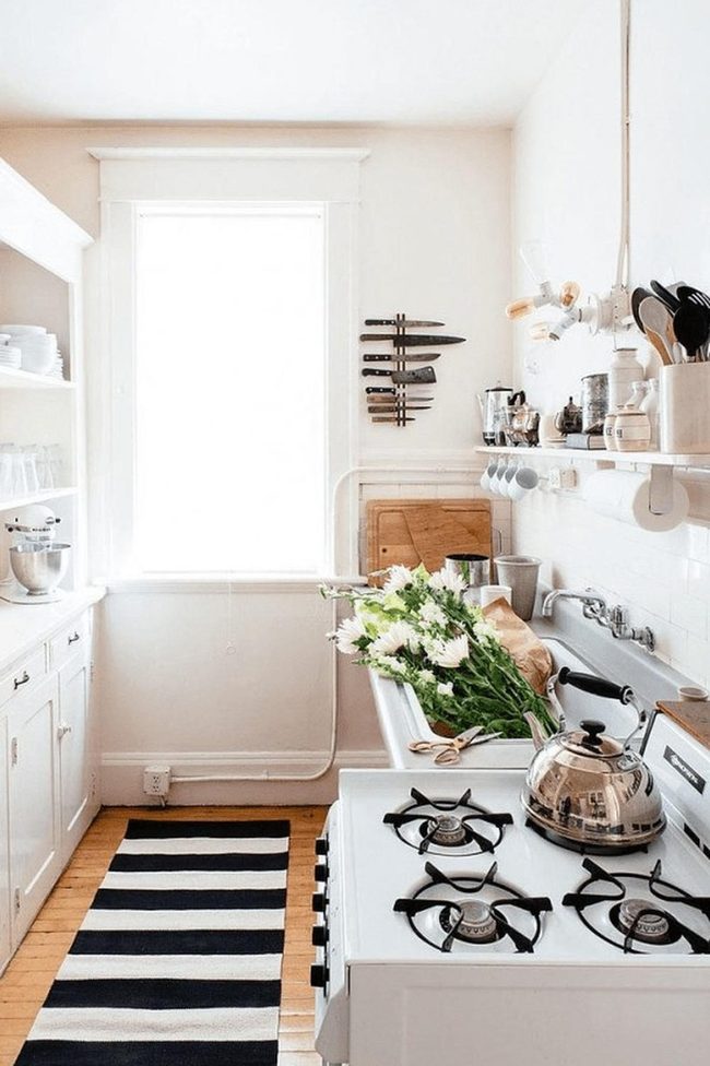 White Walls, Striped Rug, Fresh Flowers