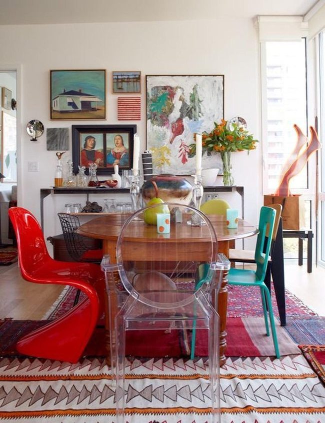 Multicolored Chairs Around Warm Wood