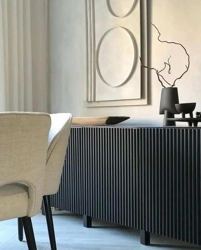 Black Furniture Against Pale Walls
