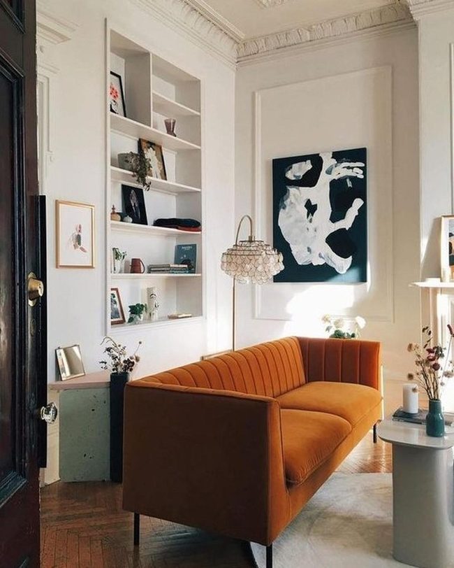 Orange Couches Meet Black Abstract Art