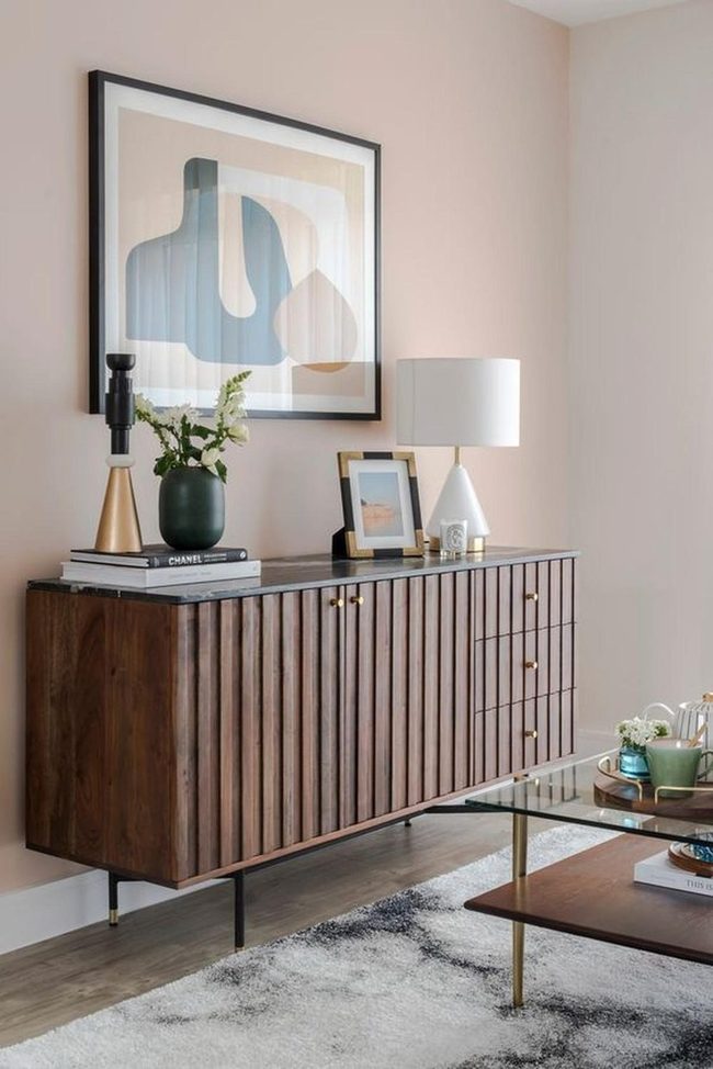 Peach Walls, Grooved Wood, Gold Accents