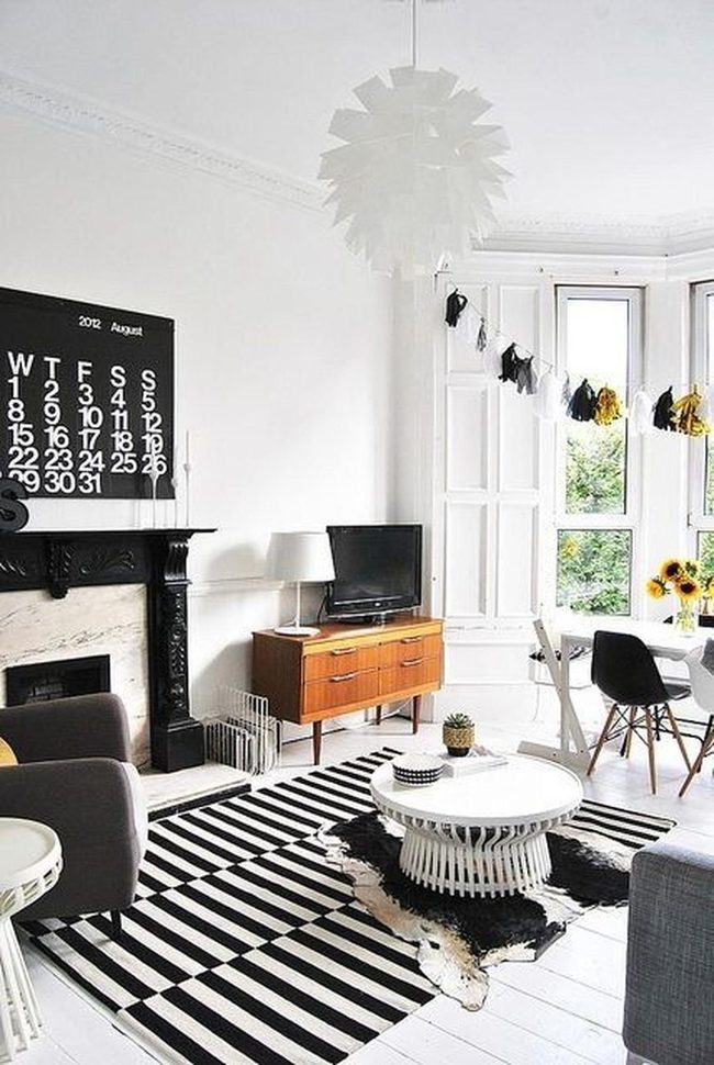 Black Fireplace Anchors Modern Warmth
