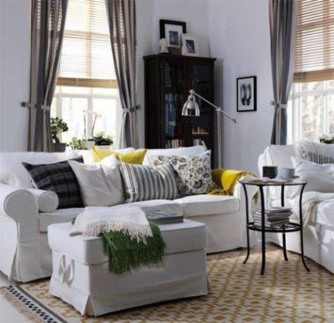 Gray Curtains And Layered White Sofas