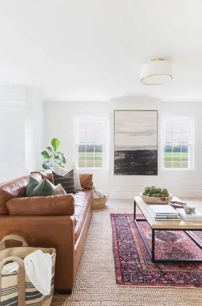 Sunlit Living Room With Leather And Layers