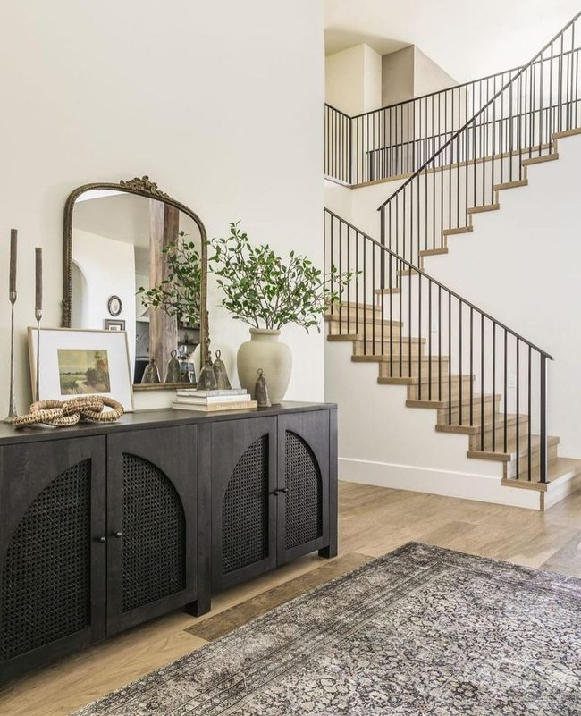 Ornate Mirror Amplifies Entryway Light