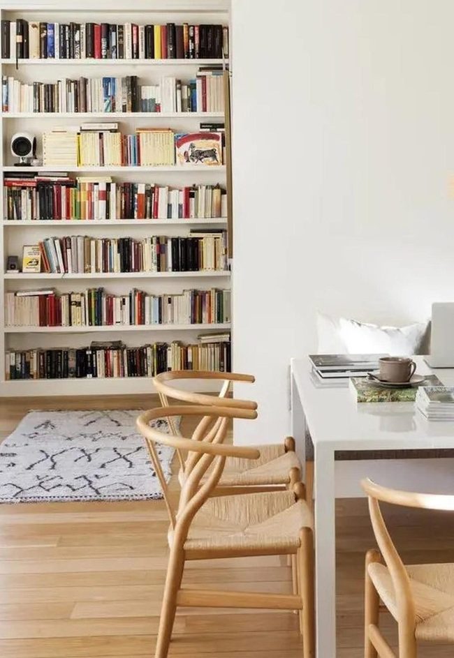 Colorful Books On White Shelves