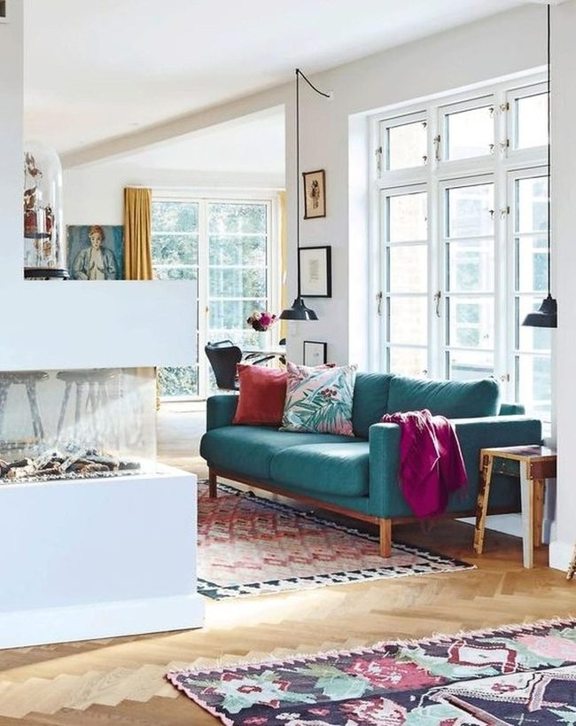 Green Couches, Natural Light Spaces