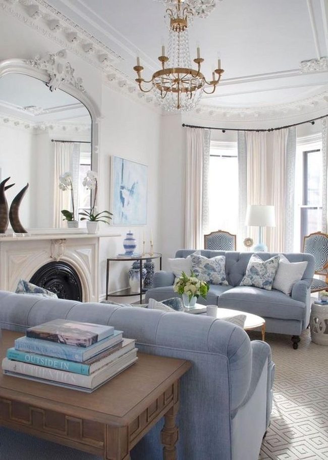 Light Blue Sofas And Mirrored Calm