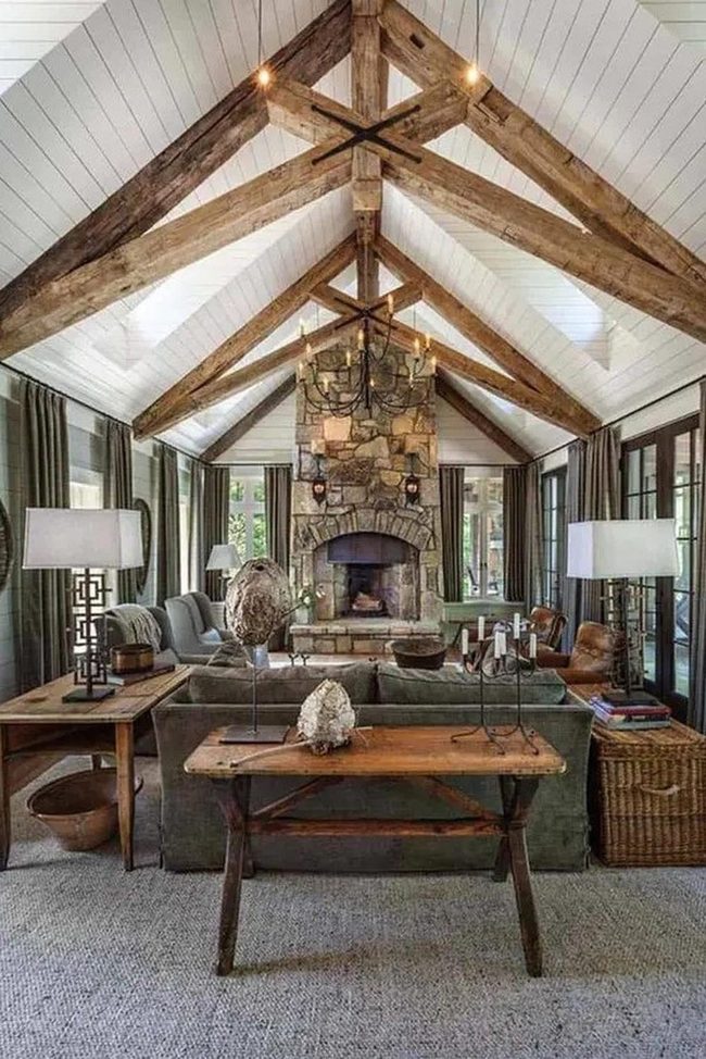Exposed Beams And Stone Fireplace