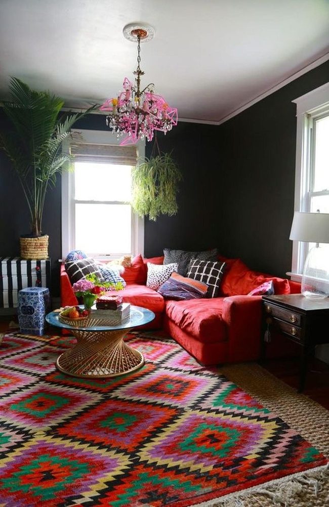 Red Couch Anchors Dark Walls