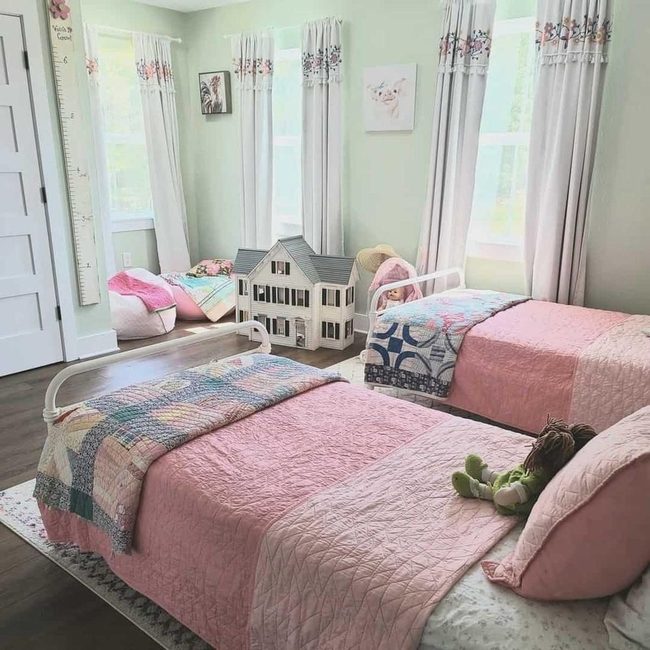 Pink Farmhouse With Dark Wood Floors