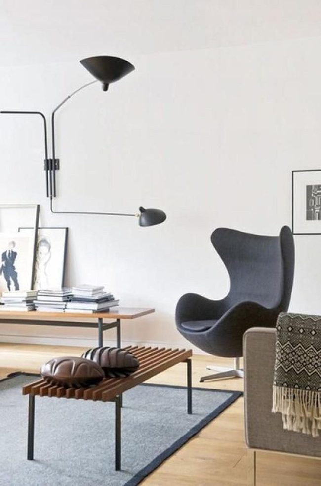 Dark Curved Chair Anchors Light Space