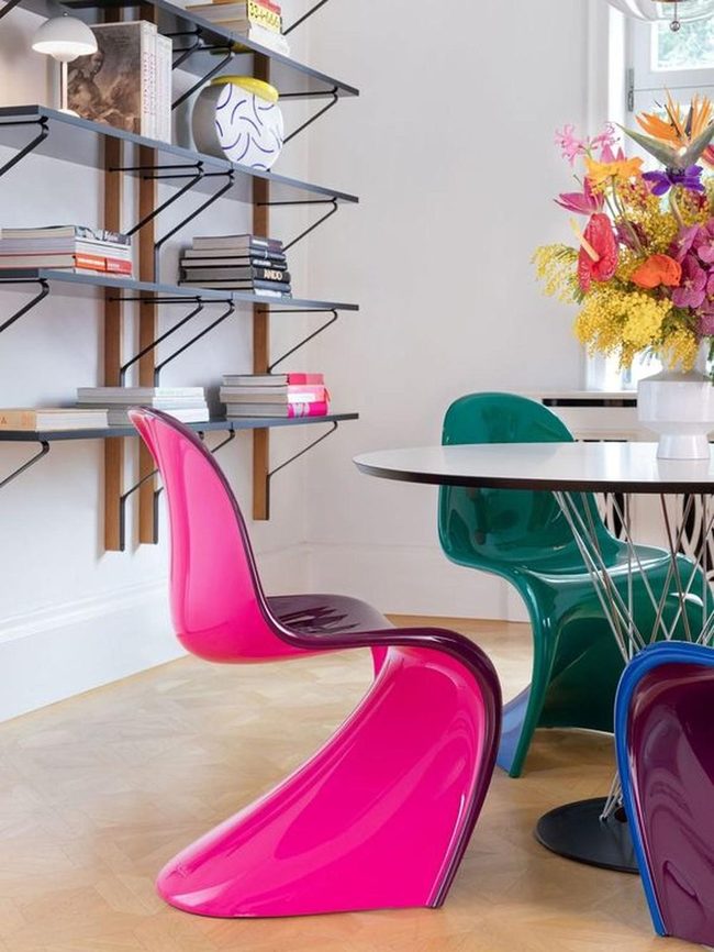 Colorful Chairs Around Modern Dining