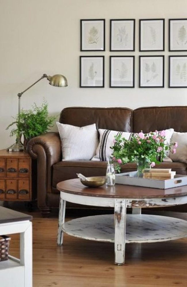 Brown Leather Sofa With Botanical Prints