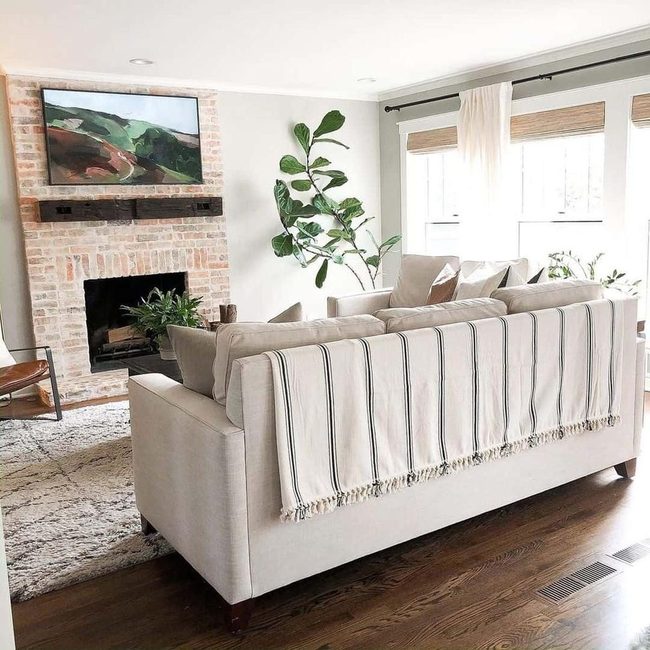 Cream Sofa Red Brick Fireplace
