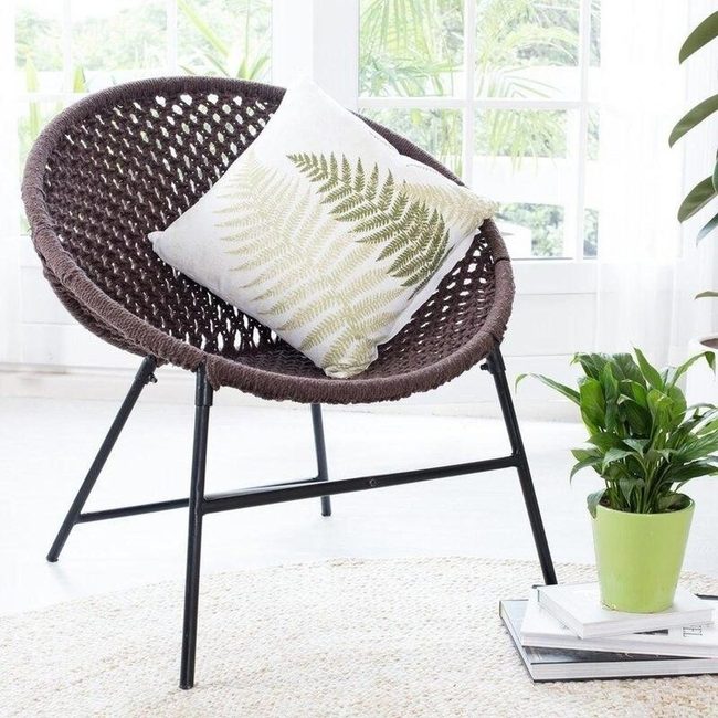 Brown Wicker Chair With Fern Pillow