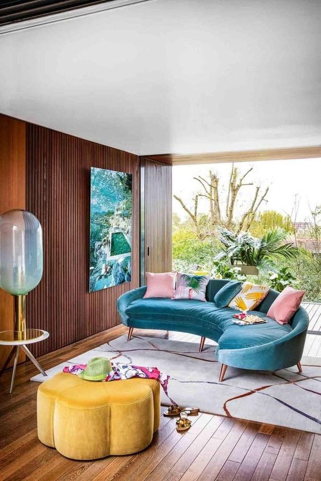 Blue Curved Sofas, Rainbow Cushions