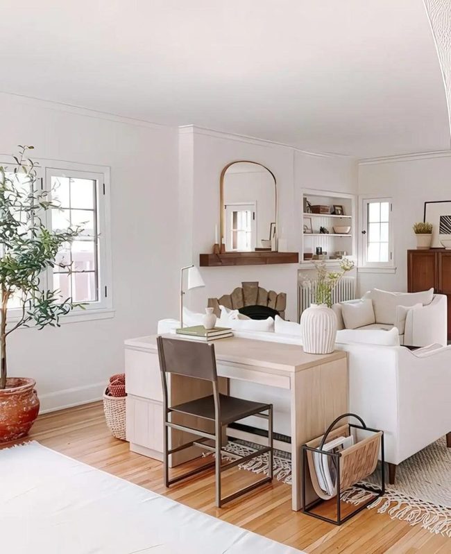 Sunlit White Space With Dark Mantel