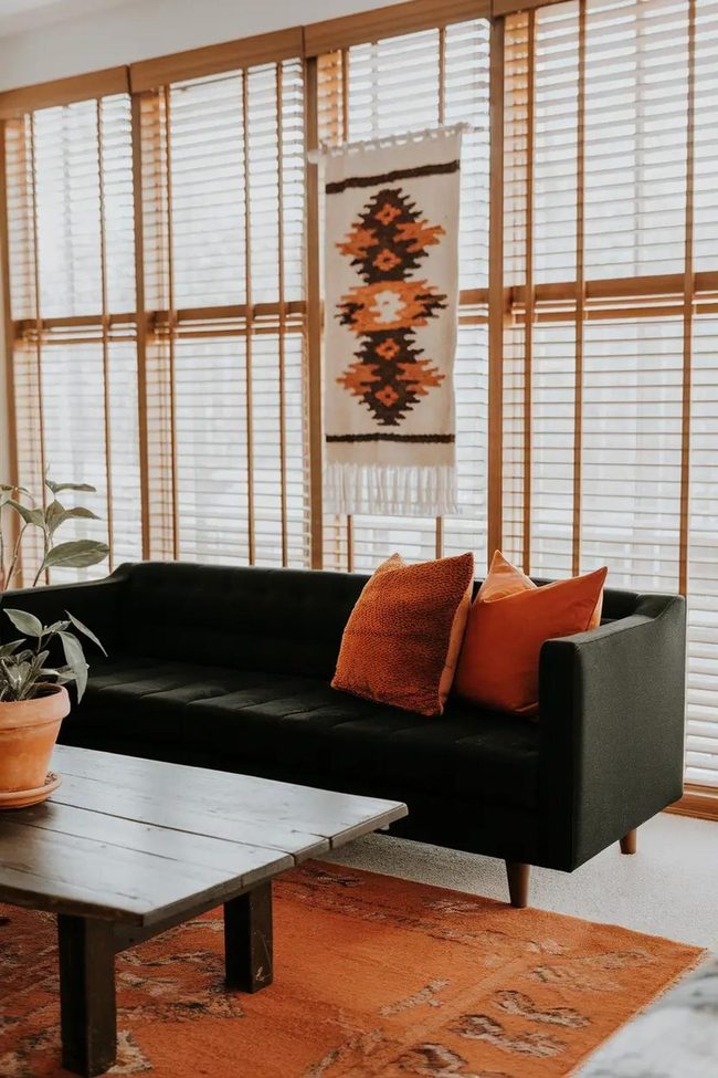 Black Sofa Meets Burnt Orange