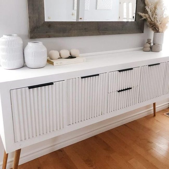 Thick Wood Mirror Above White Grooved Sideboard