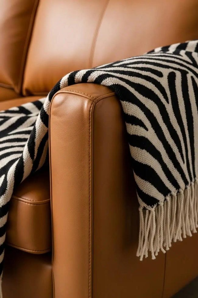 Zebra Throw On Caramel Leather Sofa