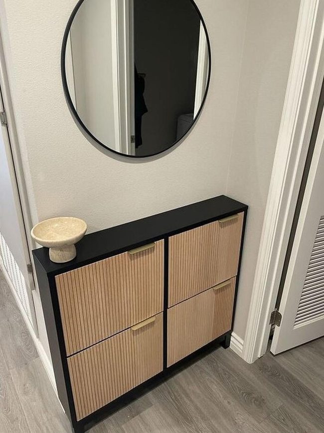 Round Mirror And Black Wood Cabinet