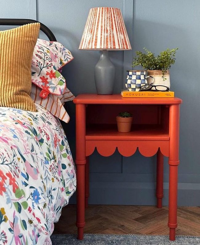 Red Nightstand Anchors Colorful Bedroom