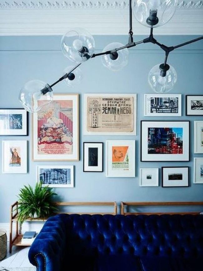 Navy Tufted Sofas With Warm Wood Details
